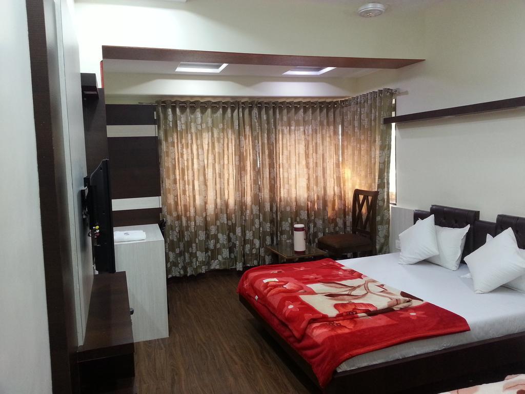 Hotel Oasis Мумбаи Номер фото